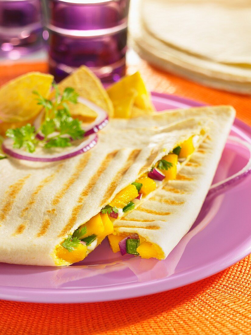 Quesadillas filled with mango and poblano