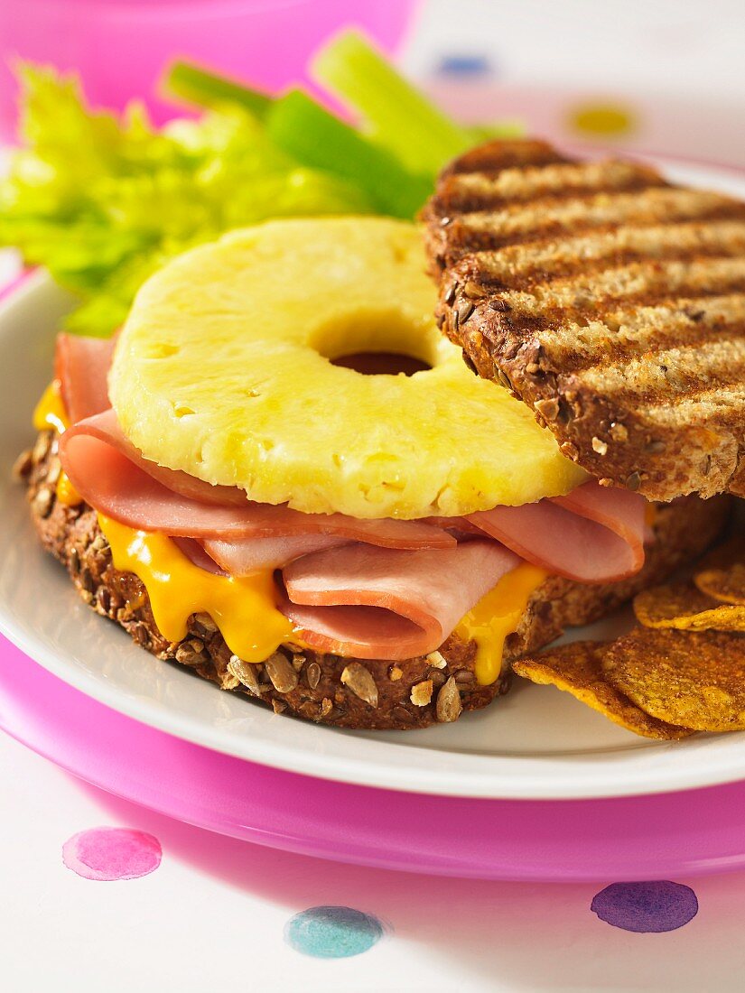 Grilled wholegrain bread topped with ham, pineapple and cheese