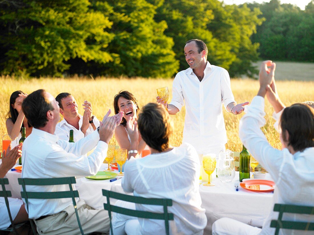 Group of people having dinner, sunset