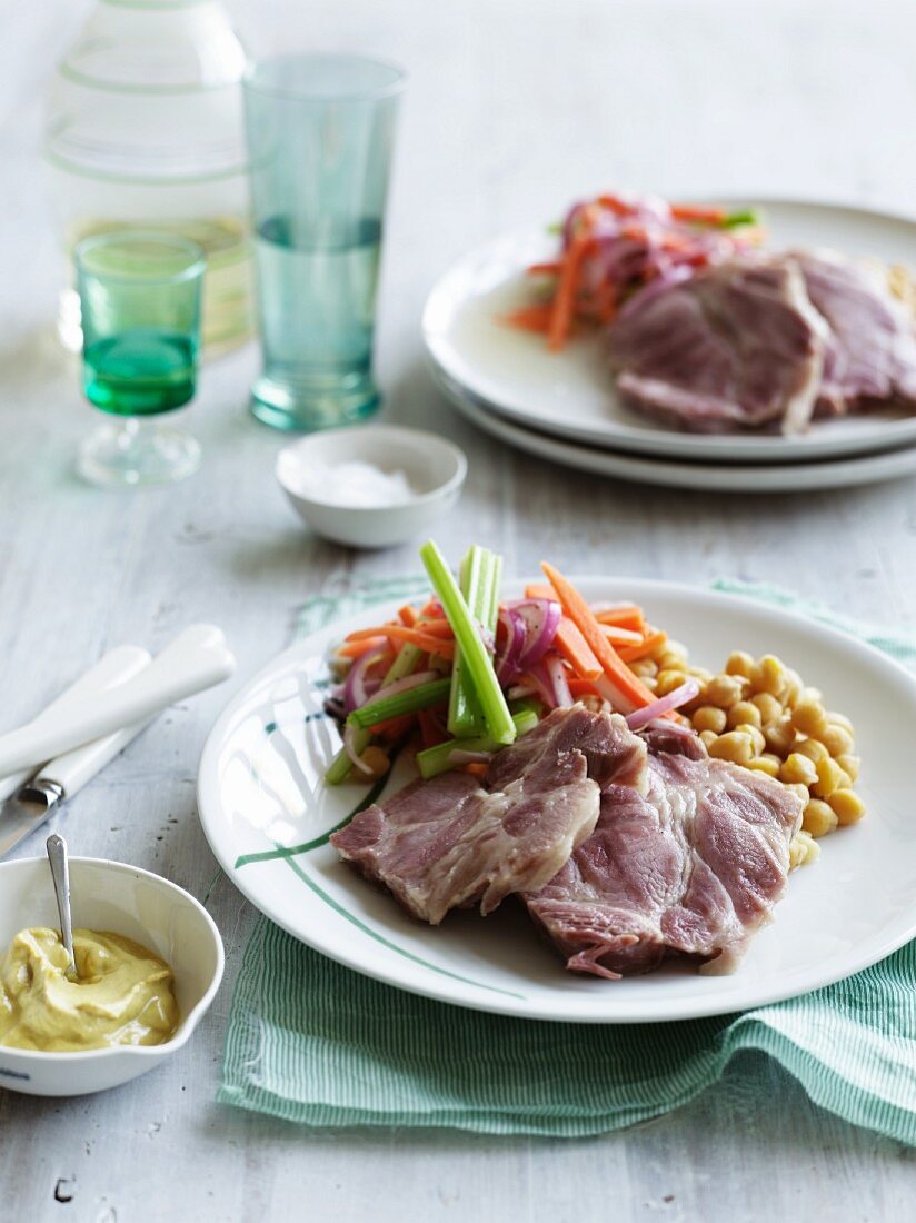 Cured pork with vegetable salad and chickpeas