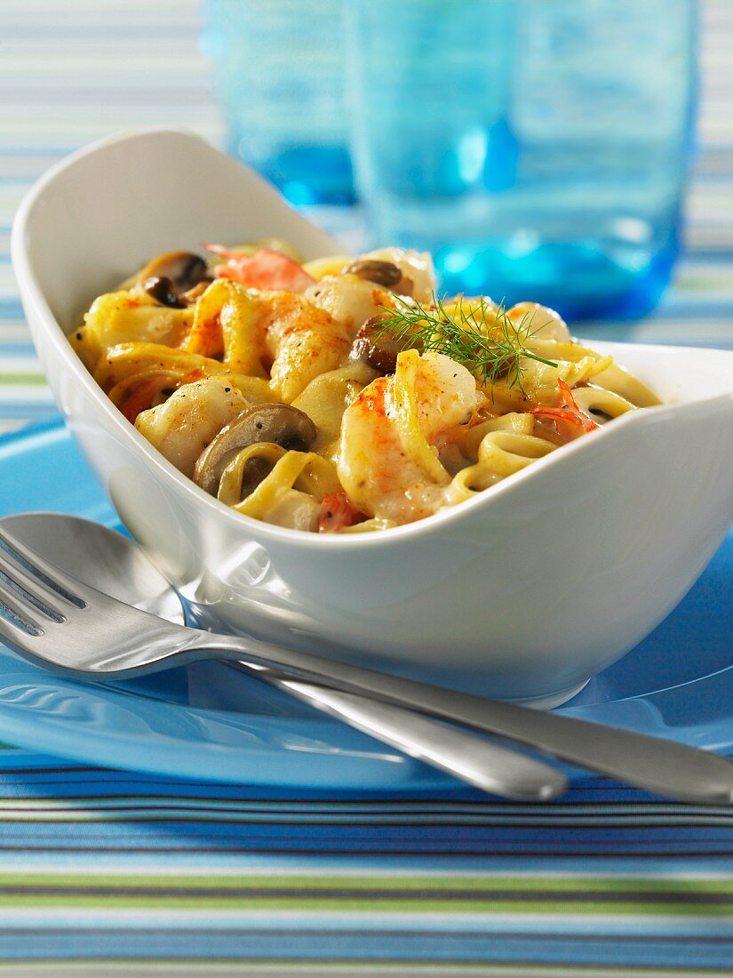 Seafood linguine topped with cheese