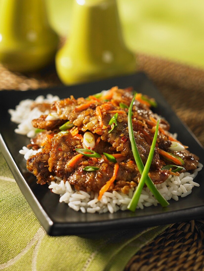 Stir-fried beef with ginger on a bed of rice