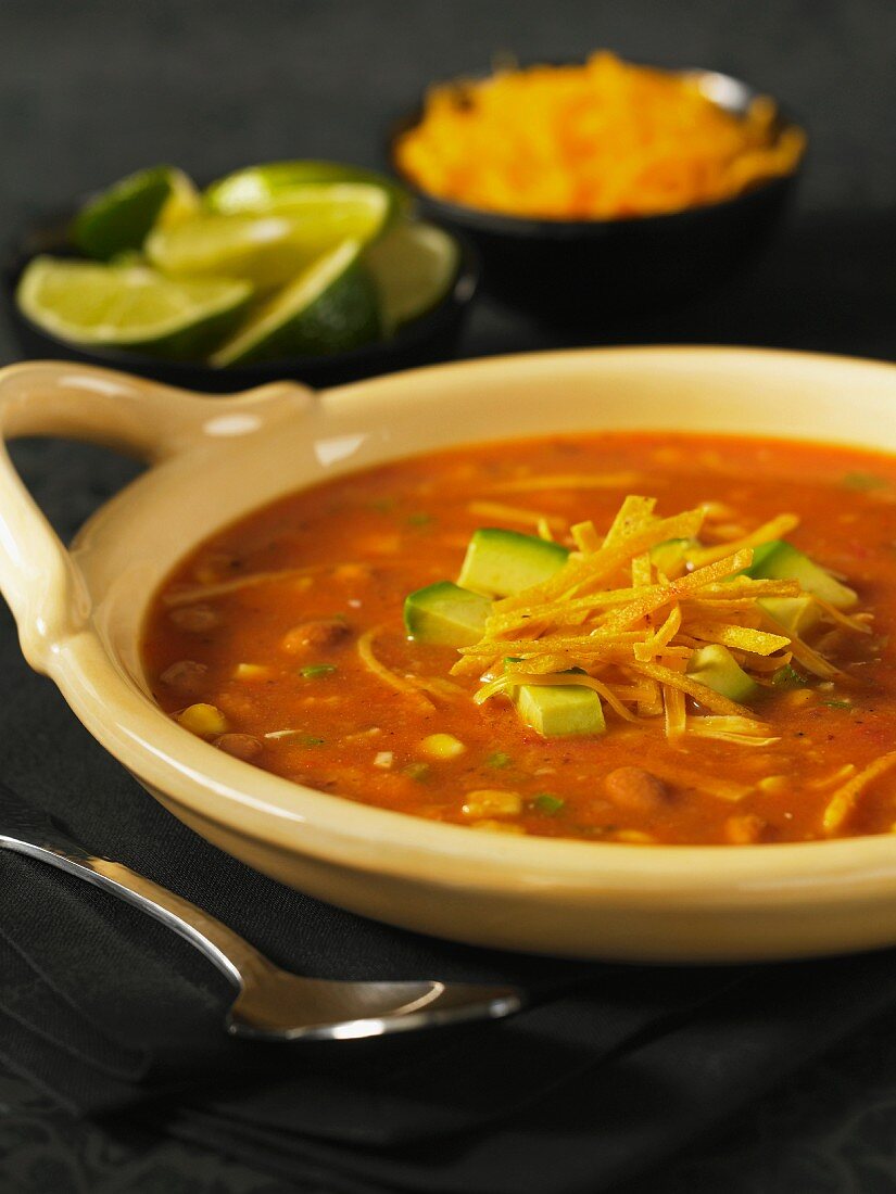 Tortilla soup with pinto beans and avocado