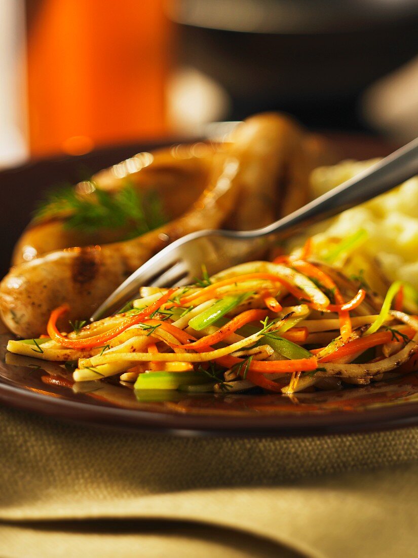 Julienned vegetables with sausages