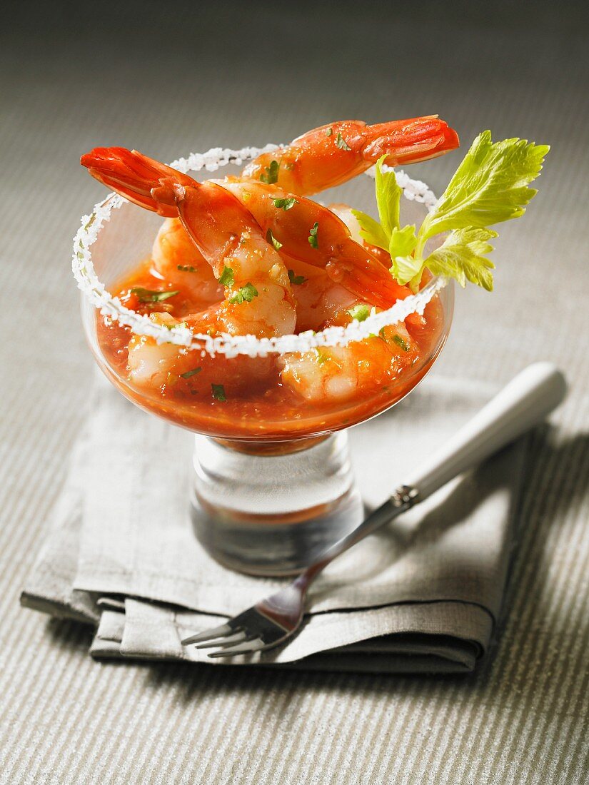 Prawn cocktail with Bloody Mary sauce in a glass with a salted rim