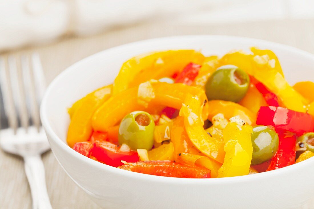 Peperonate made from peppers, olives and garlic