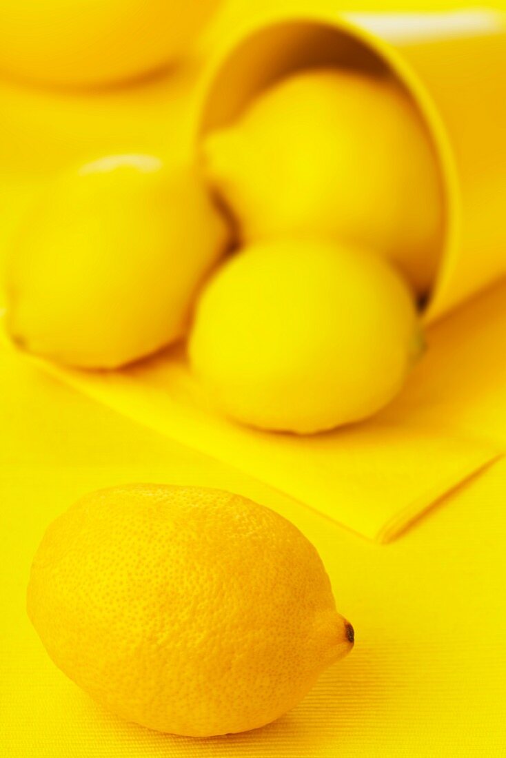 Lemons on a yellow surface