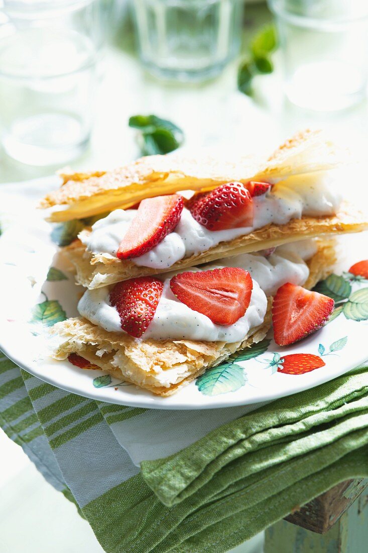 Puff pastry slices with poppyseed ice cream and fresh strawberries