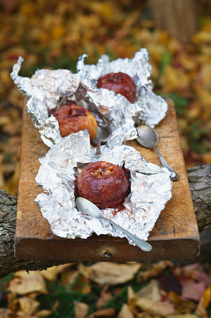 Baked apples with redcurrant jam and walnuts