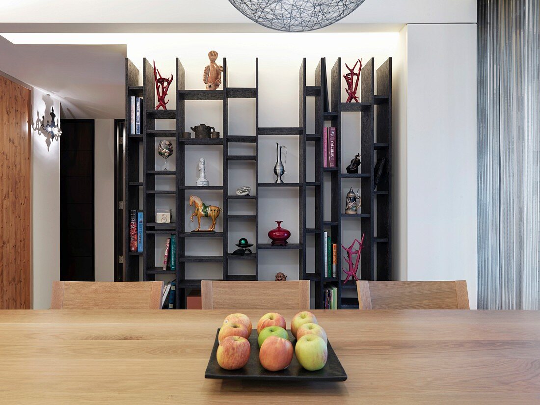 Plate of apples in center of dining room table