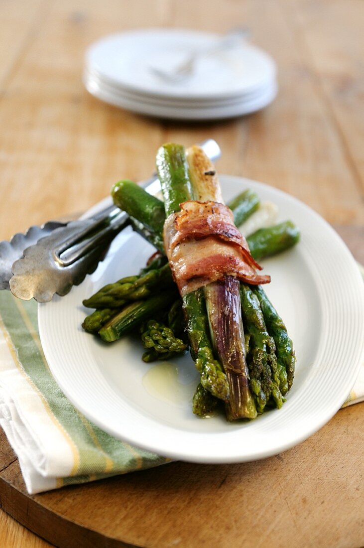 Griddled asparagus and baby leeks wrapped in pancetta