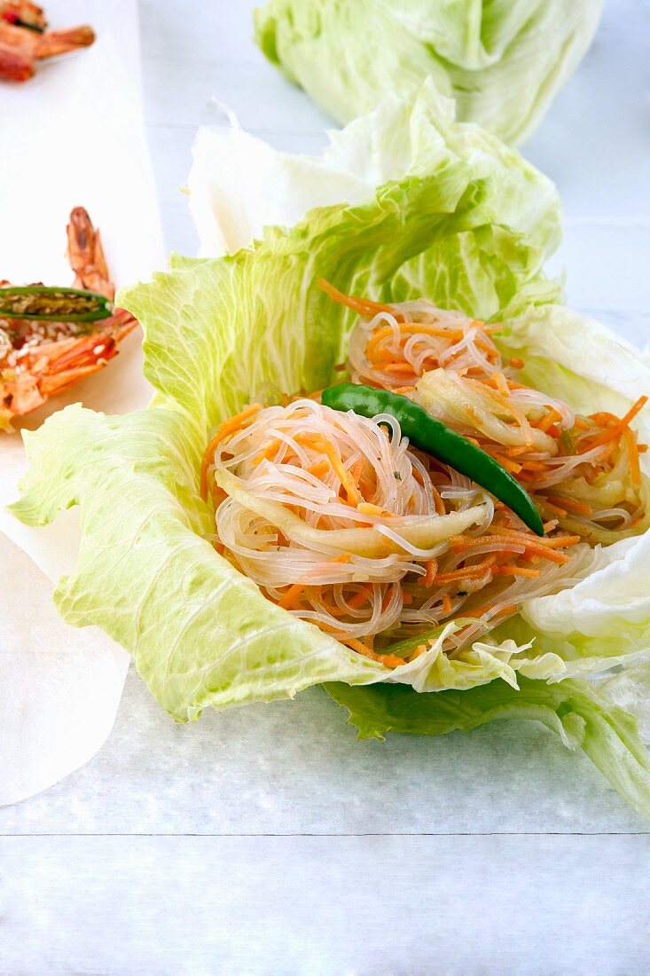 Glass noodle salad with carrots and cucumber strips in a spicy sauce