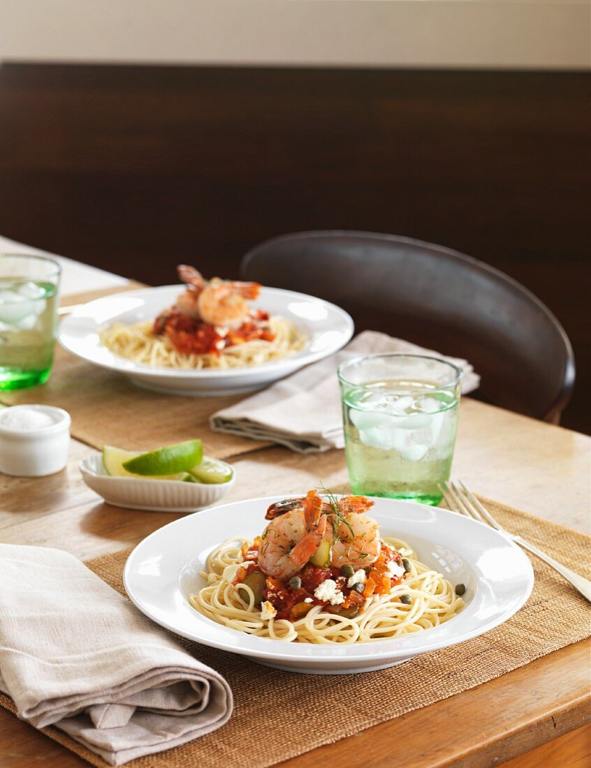 Spaghetti with king prawns, capers, tomatoes and feta cheese