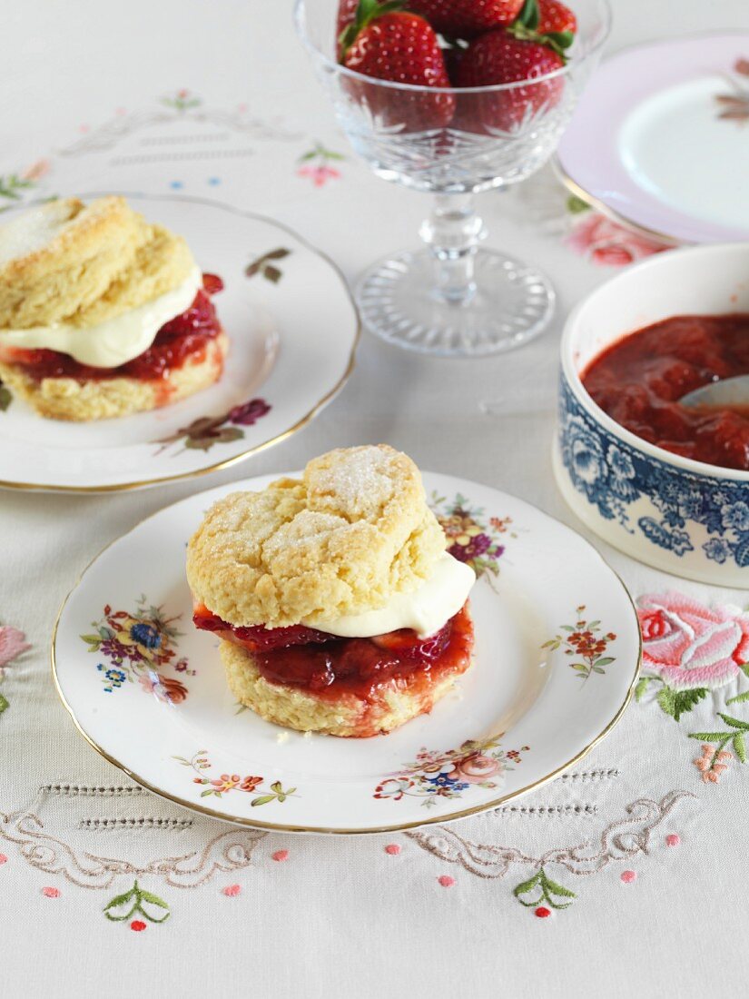 Strawberry shortcakes with cream on plates