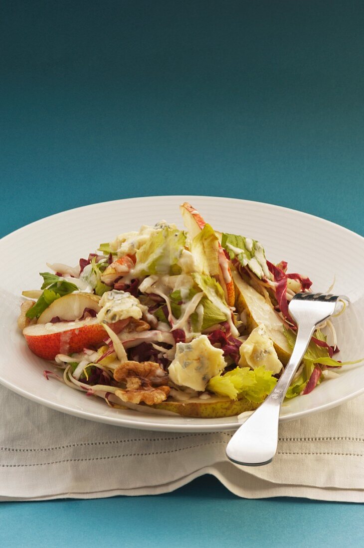 Pear salad with celery, blue cheese and walnuts
