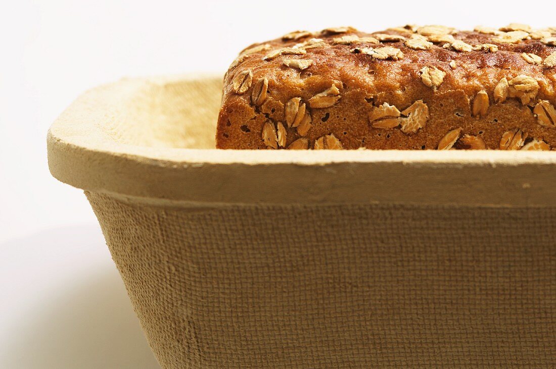 Wholemeal bread with oats in a box
