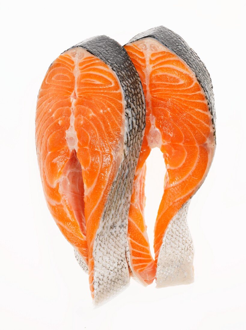 Two Salmon Steaks on a White Background