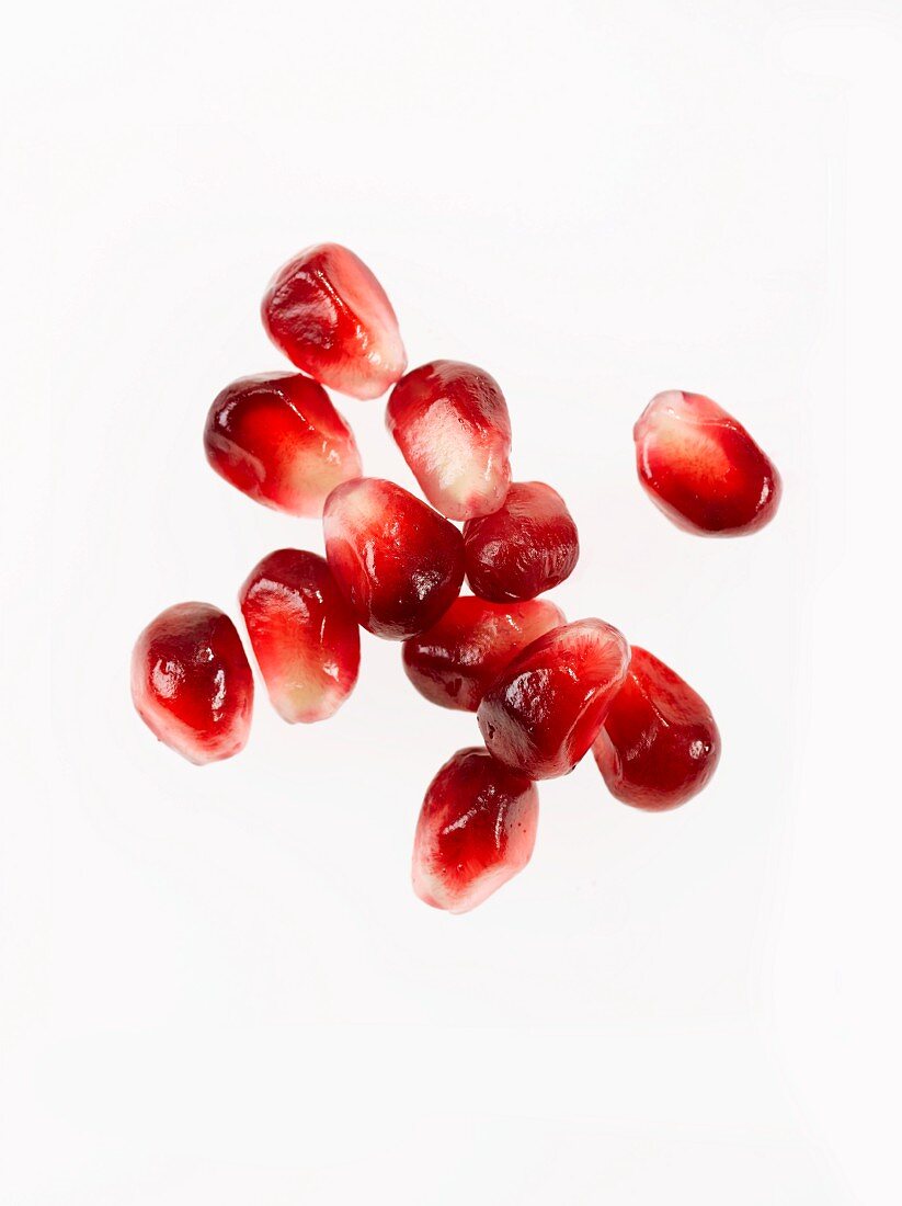 Fresh Pomegranate Seeds on a White Background
