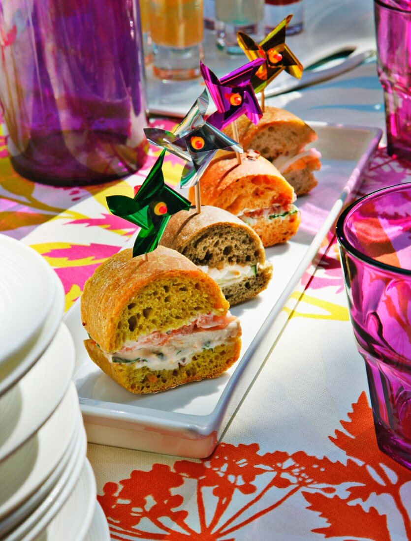 Exotic sandwiches with mini pinwheels at a summer buffet in the garden