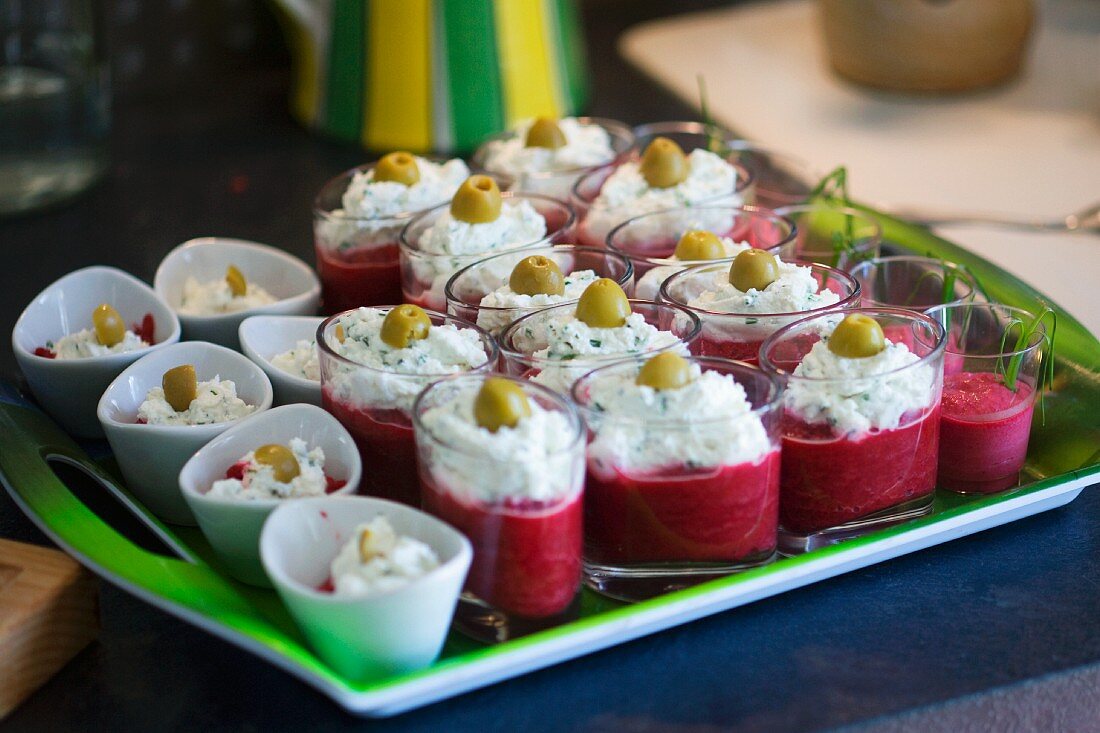Beetroot puree with cream cheese topping and green olives