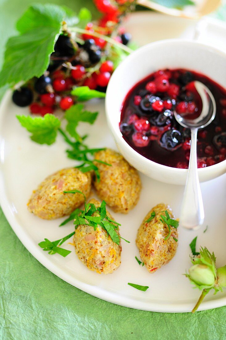 Redcurrant compote with sour cream dumplings