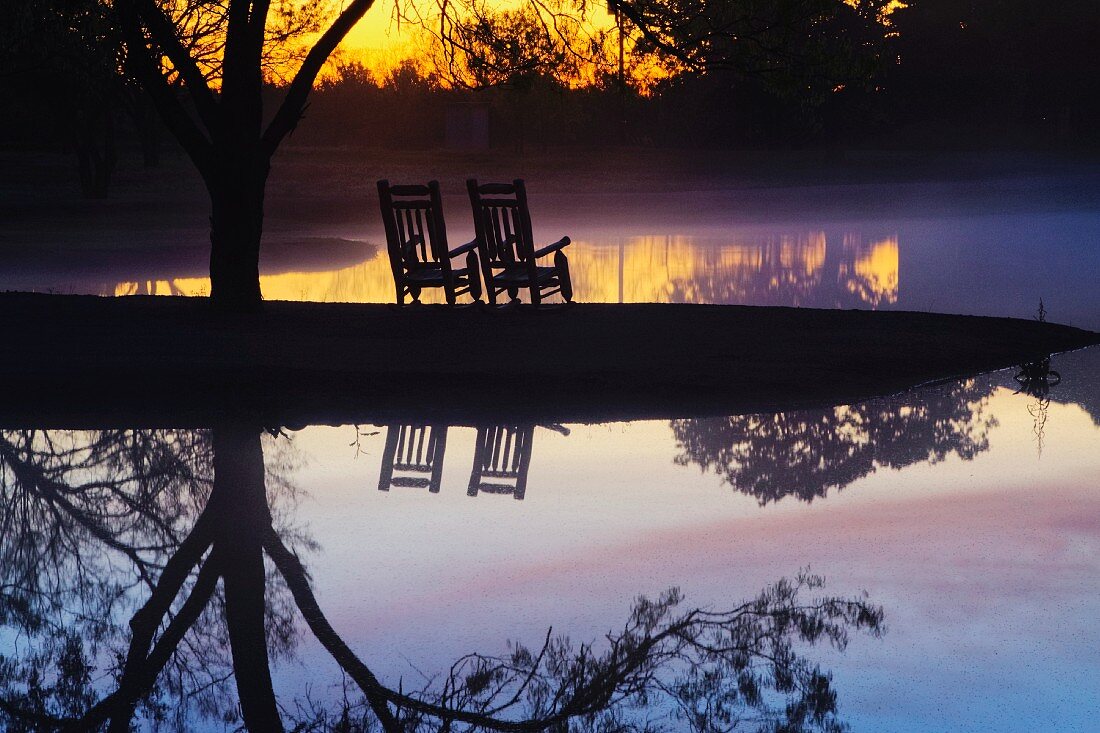 Chairs on a Beach at Sunset