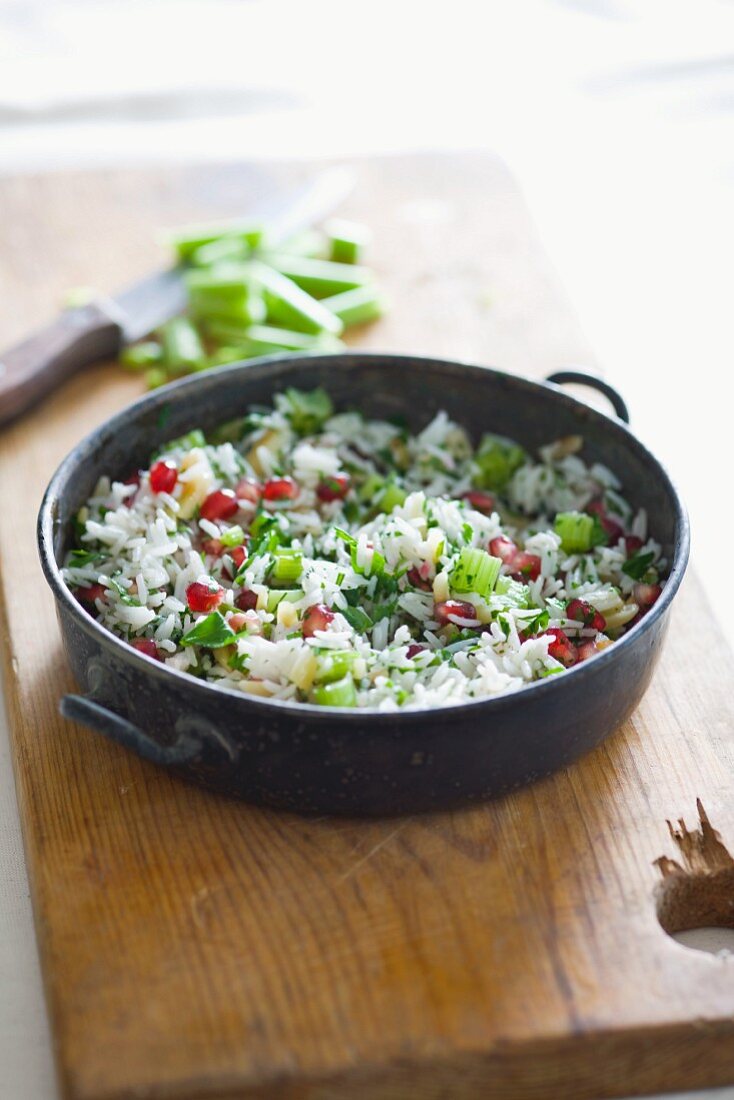 Rice with spring onions and pomegranate seeds