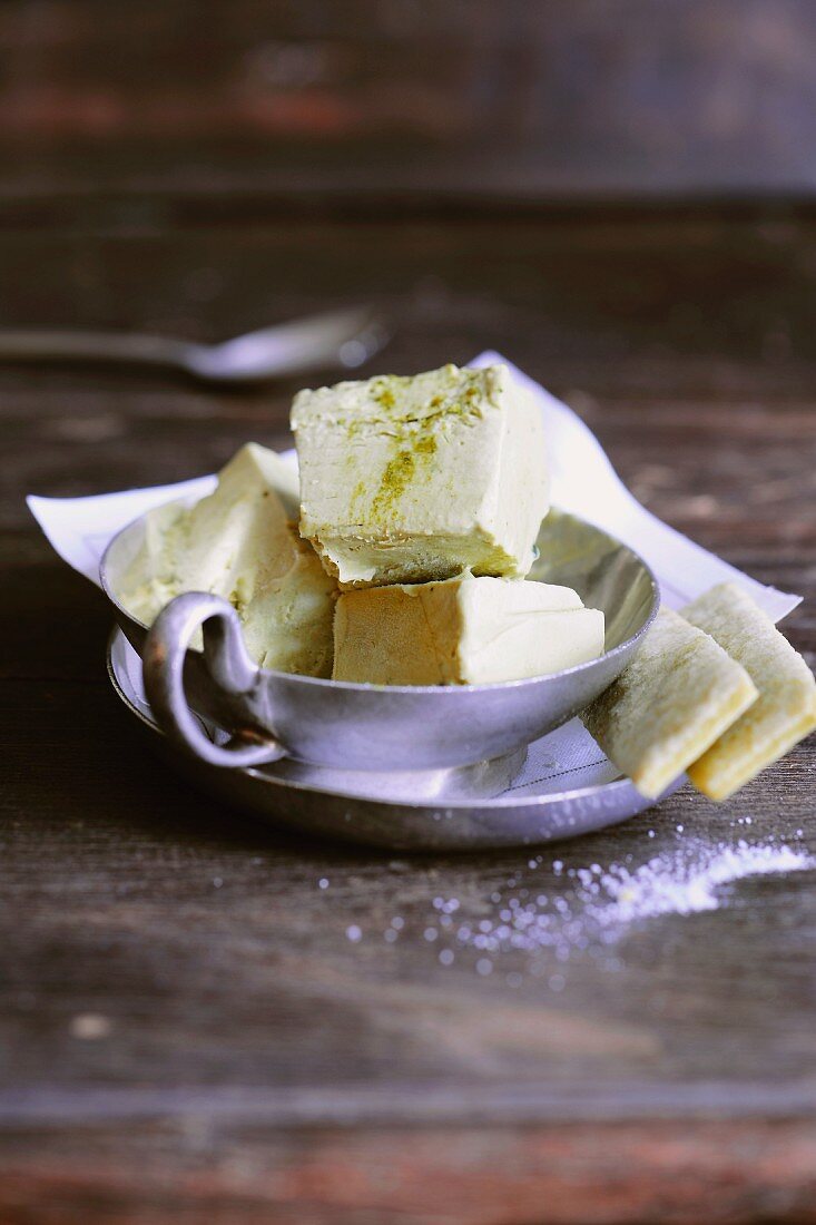 Green tea ice cream parfait with matcha sticks