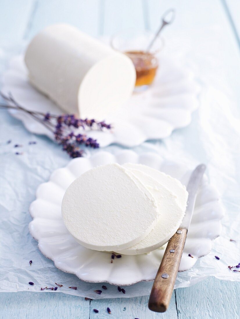 A roll of cream cheese with lavender flowers