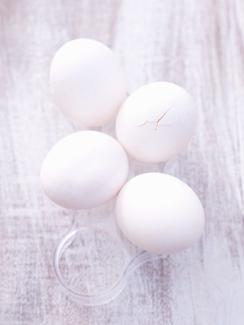 White eggs, one broken