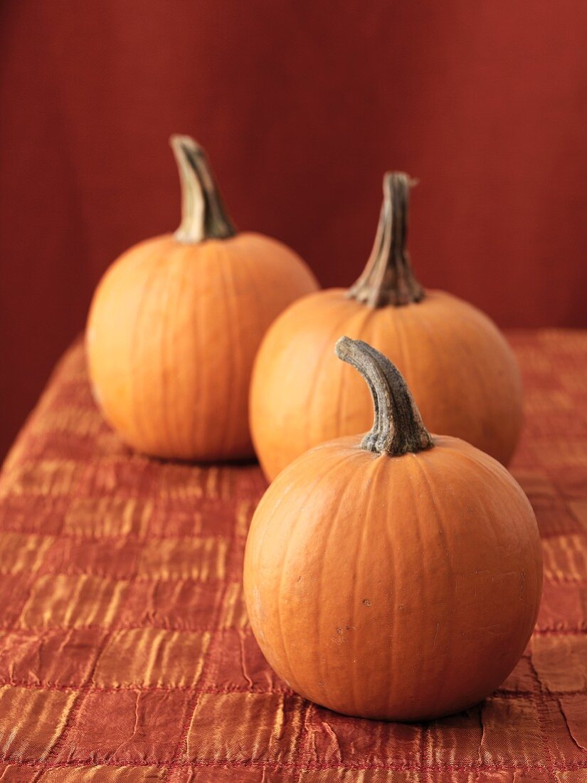 Three orange pumpkins