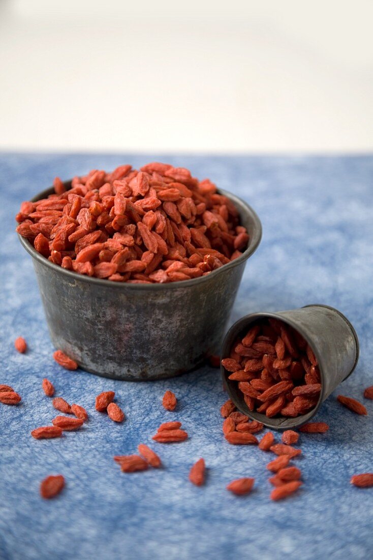 Metal Bowl and Cup of Goji Berries