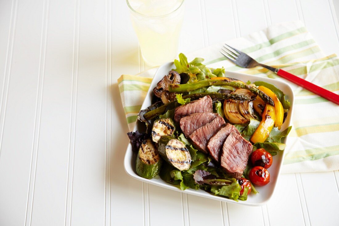 Grilled Buffalo Steak Salad with a Glass of Lemonade