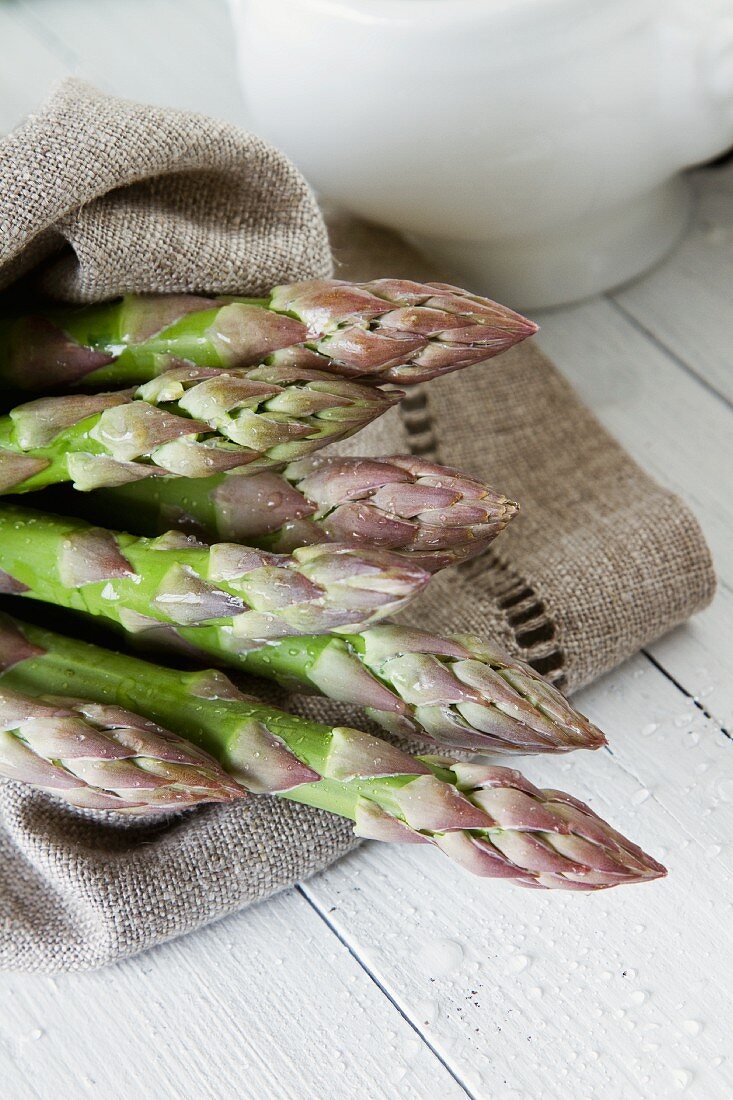 Green asparagus on a linen cloth