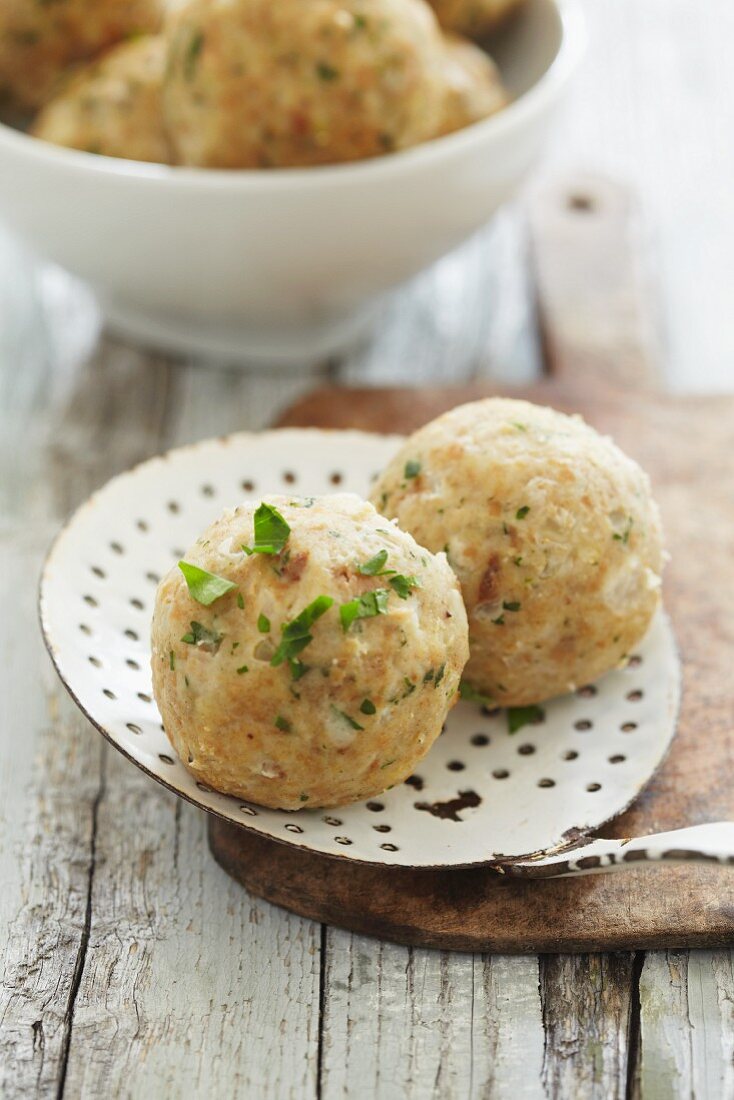 Bread dumplings on an old draining spoon