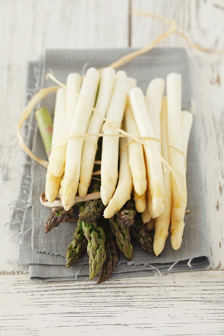 White and green asparagus on a cloth