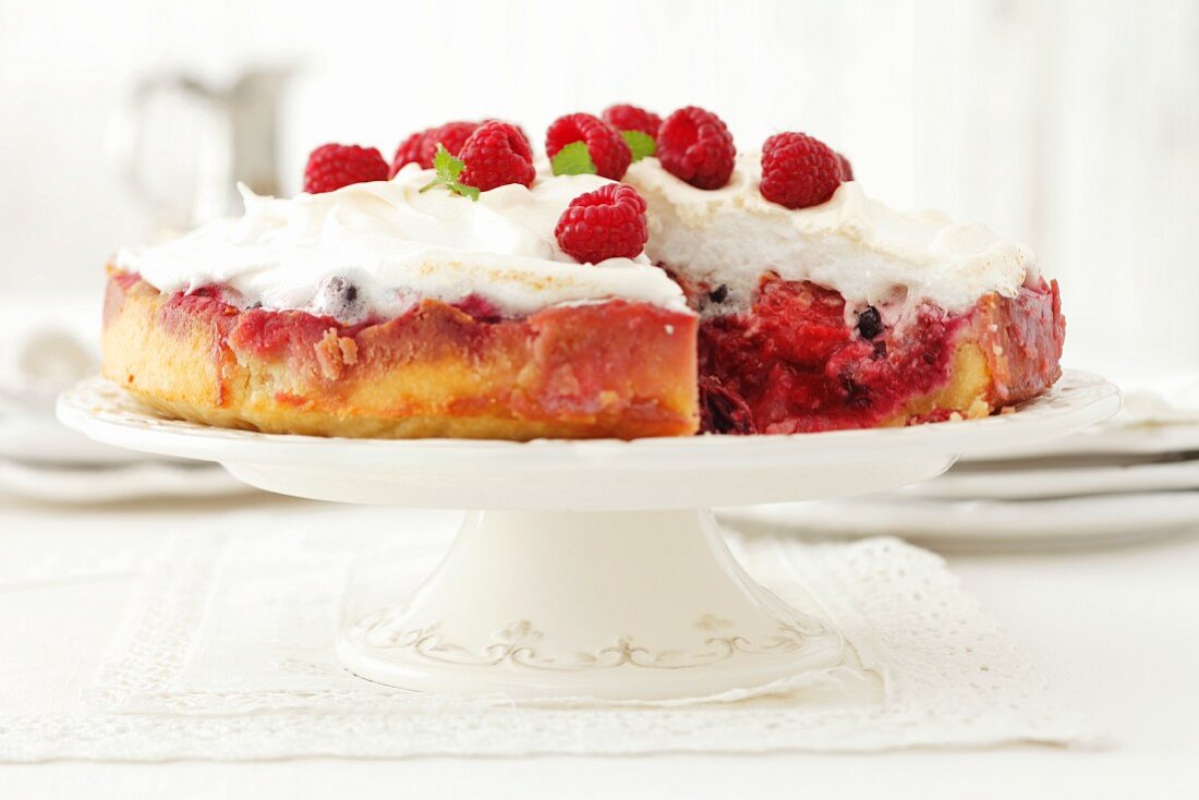 A raspberry cake topped with meringue