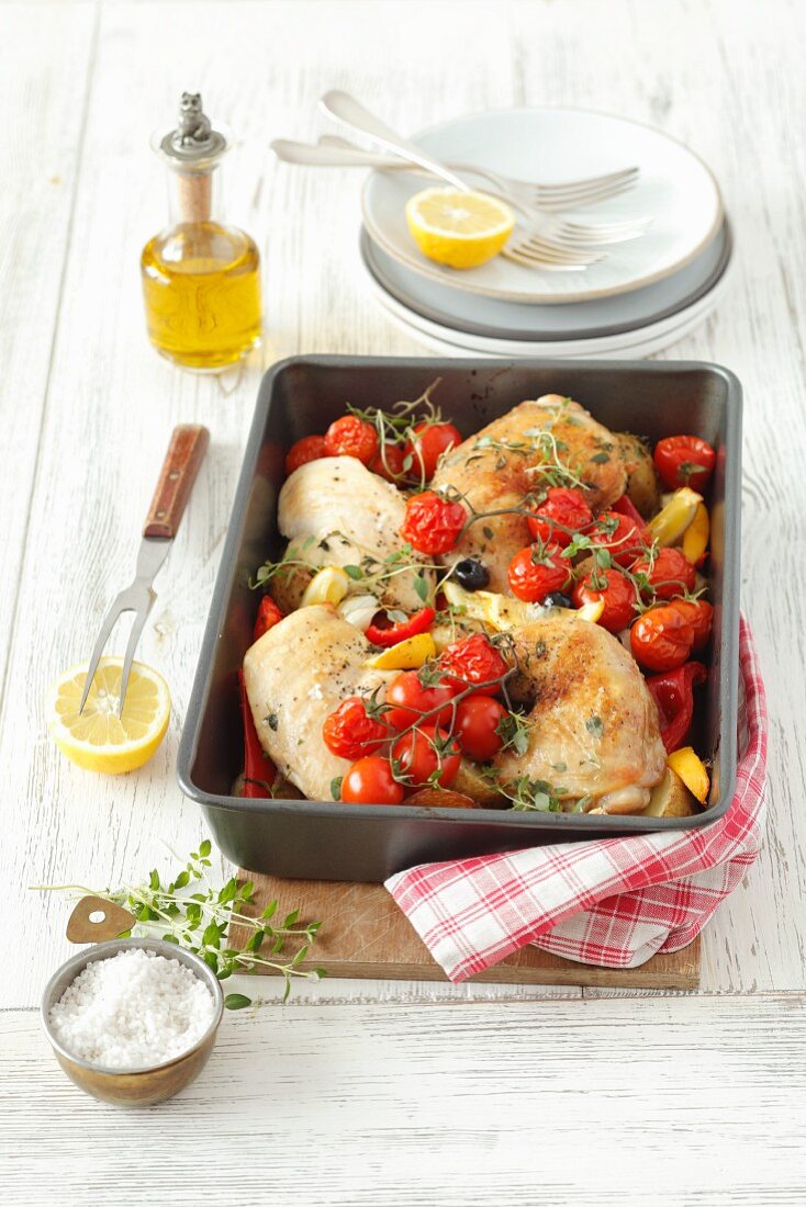Chicken legs with peppers and cherry tomatoes