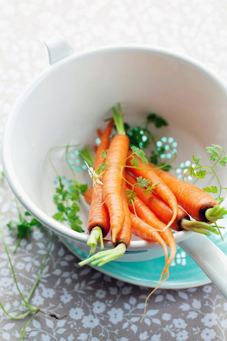 Carrots in a sieve