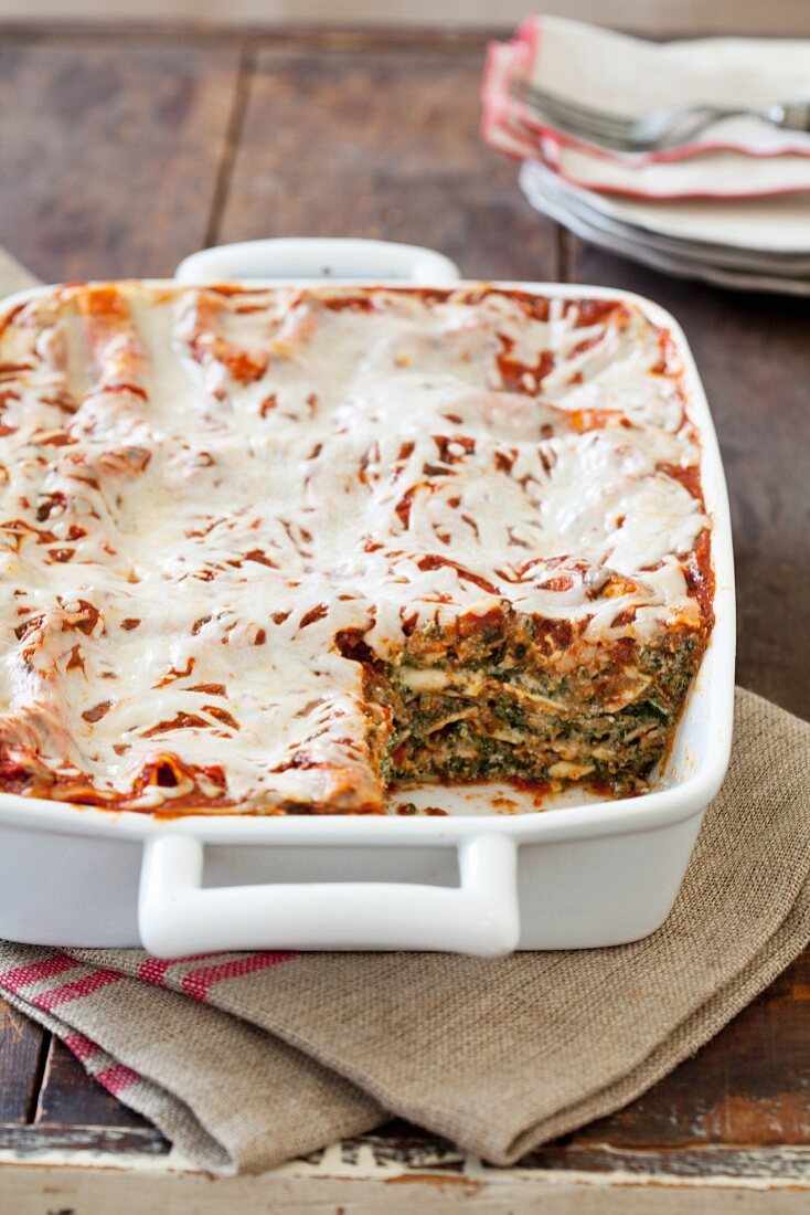 Spinach Lasagna in Baking Dish with a Serving Removed
