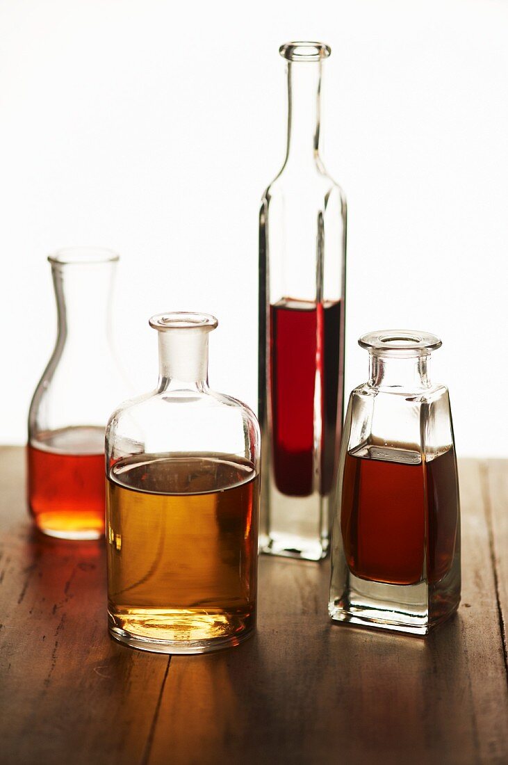 Four Assorted Bottles of Vinegars