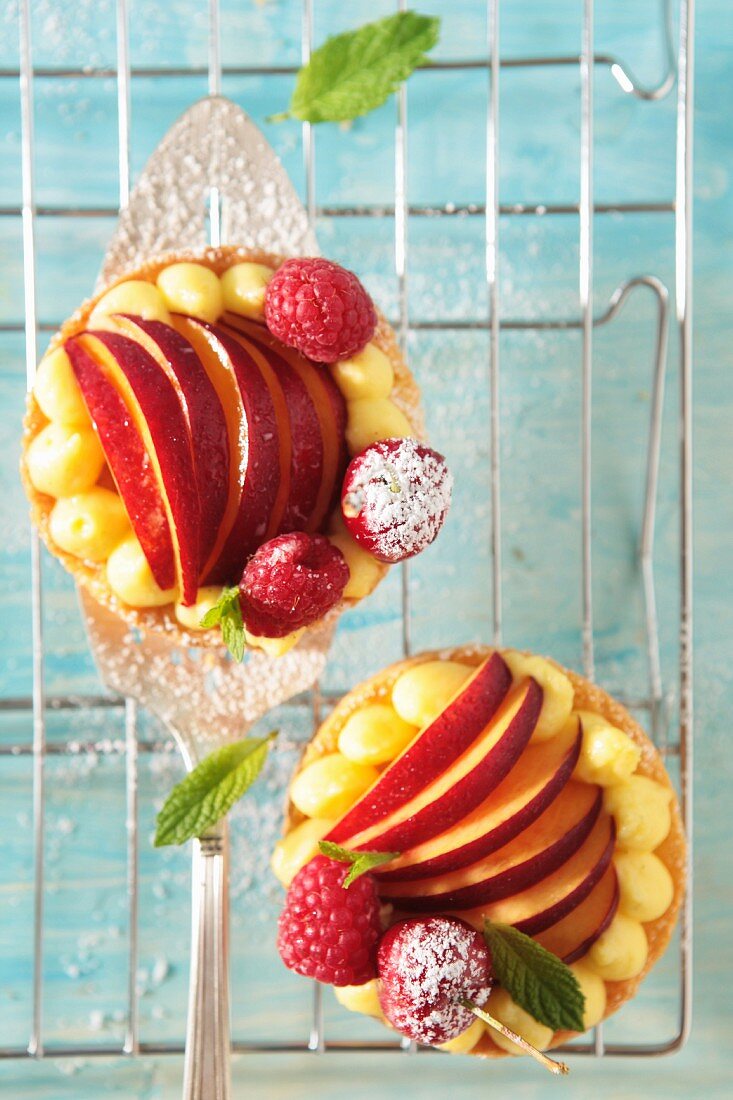 Fruit tartlets with raspberries, cherries and peaches