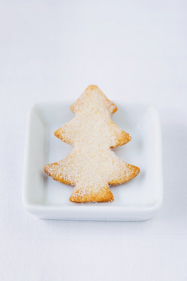A Christmas tree-shaped butter biscuit