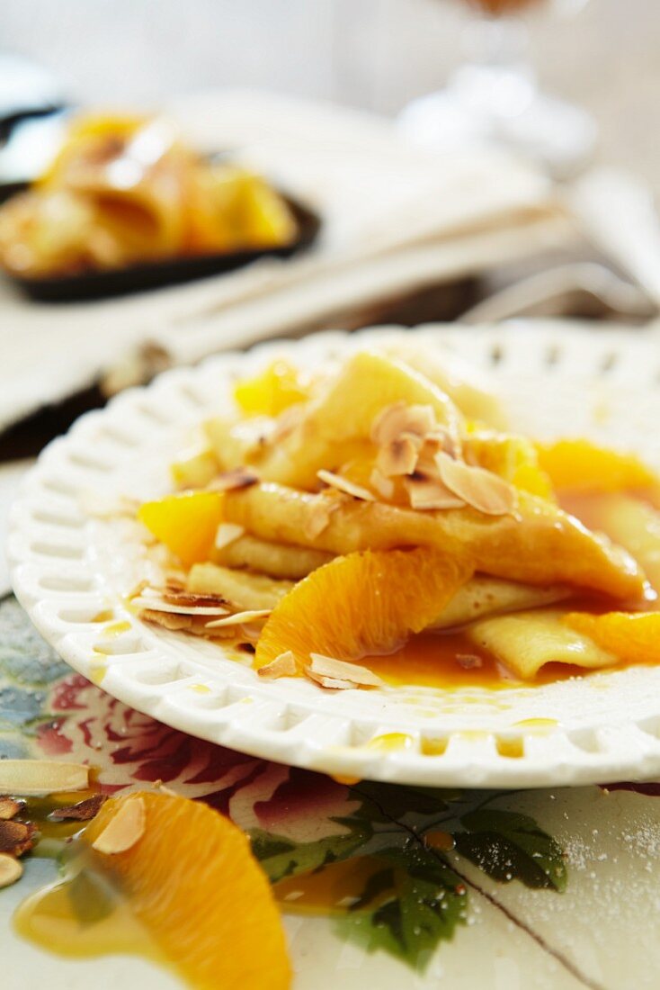 Crepes Suzette with oranges and slivered almonds