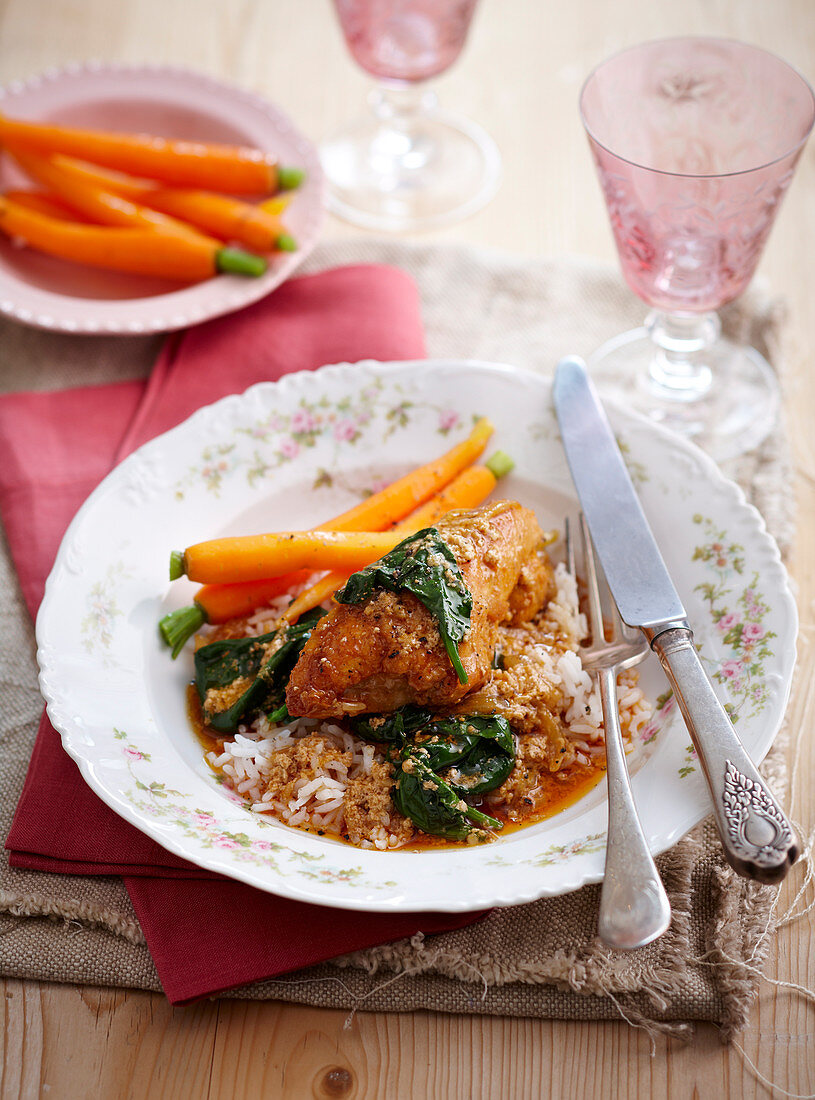 Spicy baked chicken with yoghurt, rice and carrots