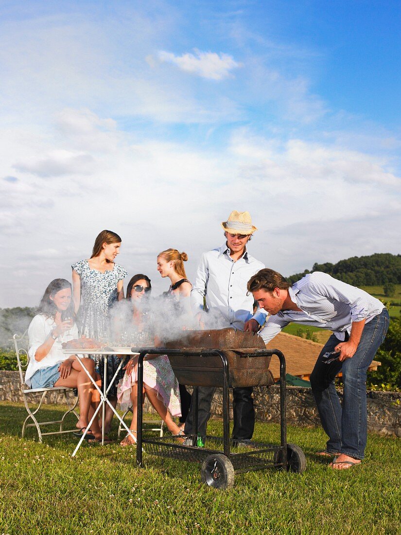 young people having barbecue
