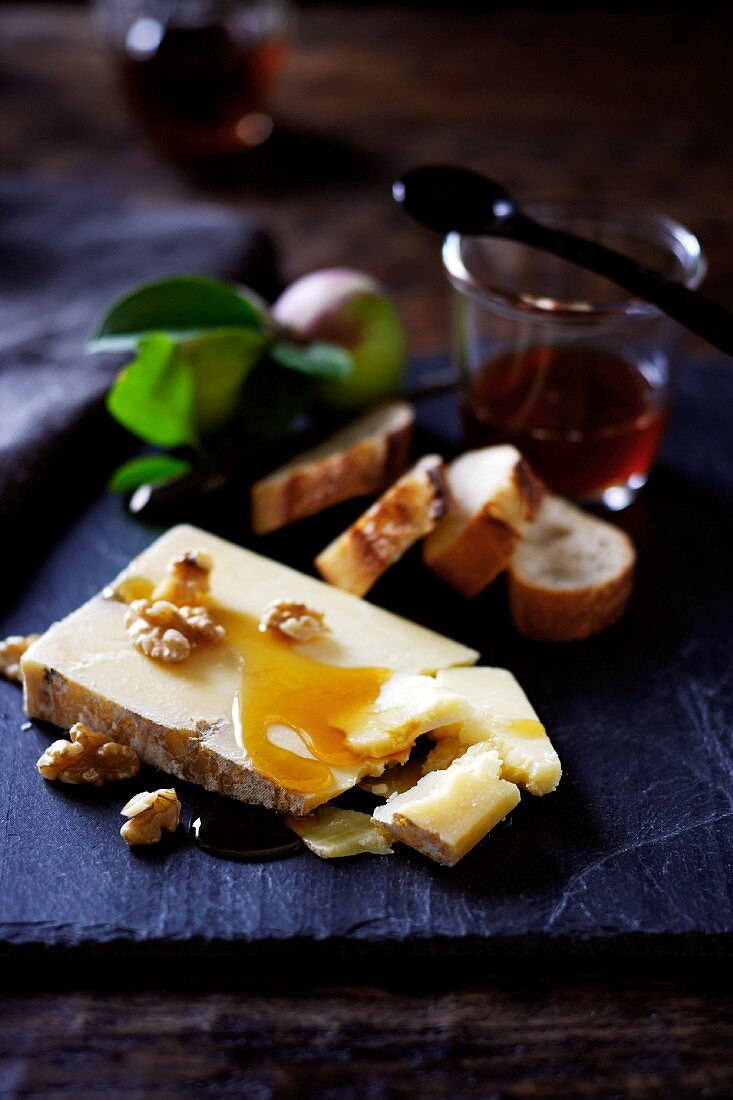 Cheese with Honey and Walnuts; Slices of Bread