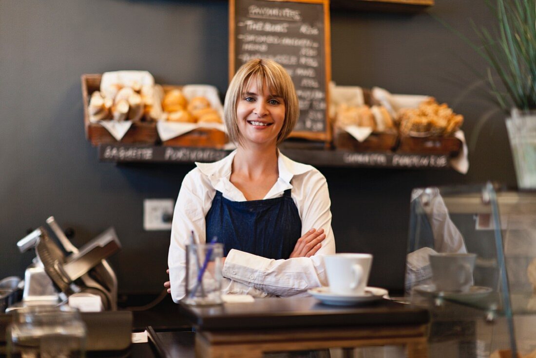 Smiling woman working in cafe