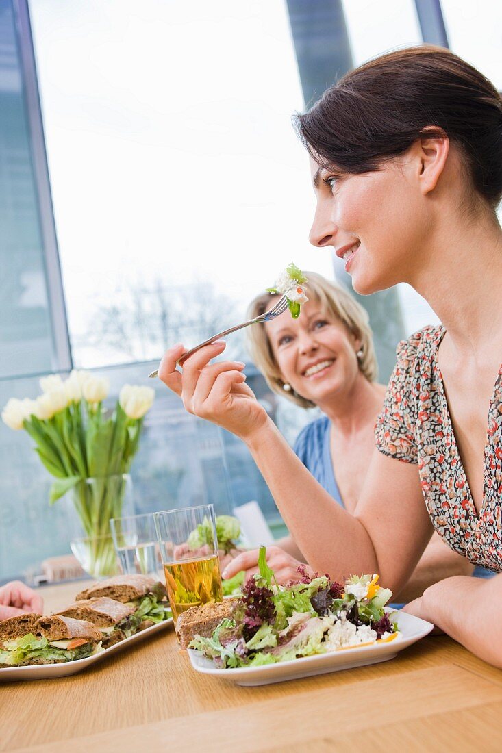 Two women eating health food