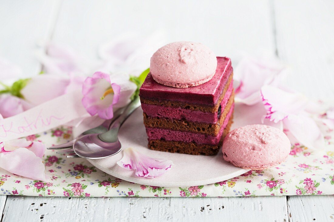 Mini berry layer cake decorated with a macaroon